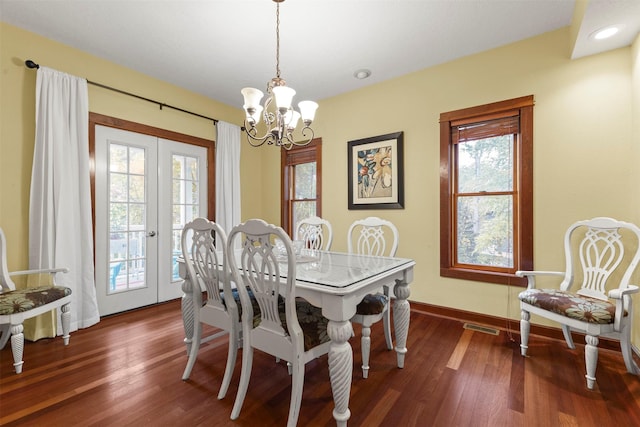 1905 W Olive St, Marshalltown, IA 50158 - dining room featuring a chandelier, plenty of natural light, french doors, and wood finished floors