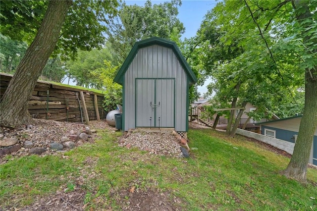 view of shed with fence