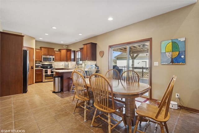 dining space featuring recessed lighting