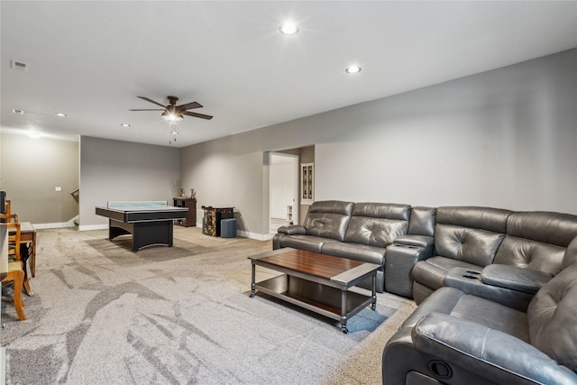 living area with recessed lighting, light colored carpet, visible vents, baseboards, and stairway