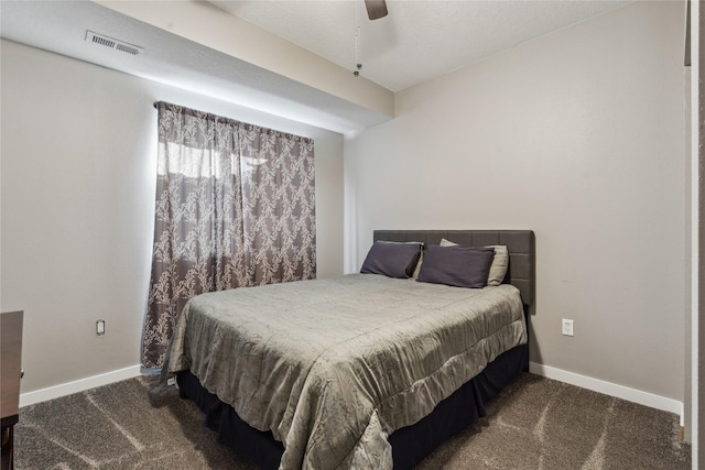 carpeted bedroom featuring a ceiling fan, visible vents, and baseboards