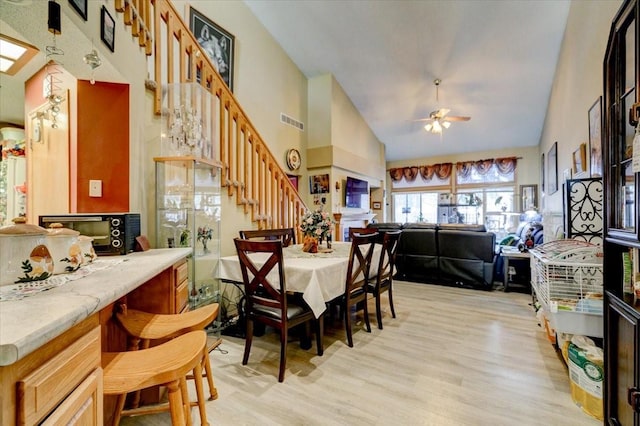 2801 Ep True Pkwy Unit 1005, West Des Moines, IA 50265 - dining room with visible vents, light wood finished floors, a ceiling fan, and stairway