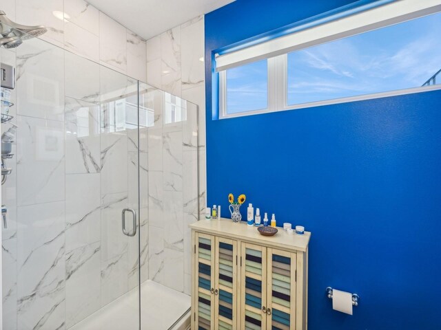 450 SW 7th St Unit 210, Des Moines, IA 50309 - full bath featuring a marble finish shower