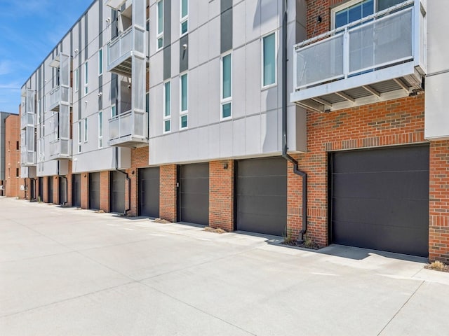 450 SW 7th St Unit 210, Des Moines, IA 50309 - view of building exterior with an attached garage