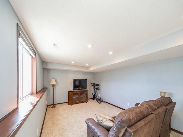 living area featuring recessed lighting, light carpet, visible vents, and baseboards