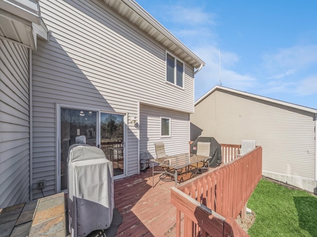 wooden deck featuring outdoor dining area