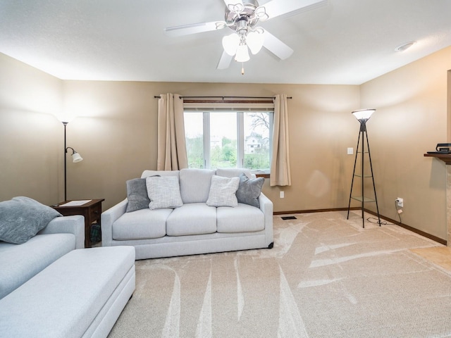 604 NW 8th St, Grimes, IA 50111 - carpeted living area featuring baseboards, a ceiling fan, and visible vents