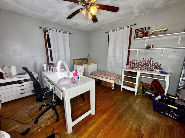 office space with ceiling fan and wood finished floors