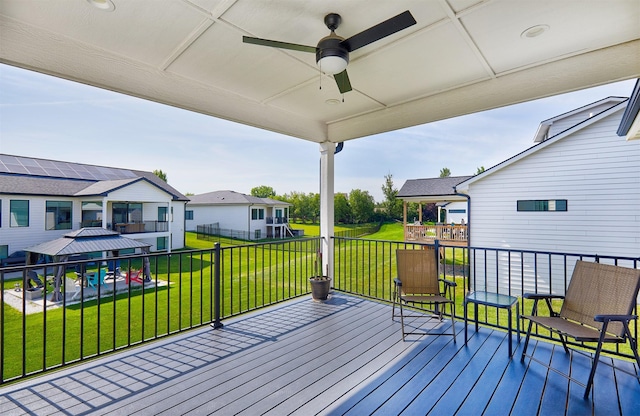 5021 148th Cir, Urbandale, IA 50323 - wooden deck with a ceiling fan, a lawn, a residential view, and a gazebo