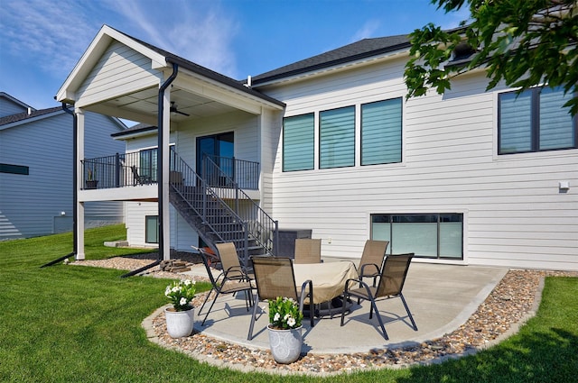 5021 148th Cir, Urbandale, IA 50323 - rear view of property with stairway, a yard, a patio, and ceiling fan