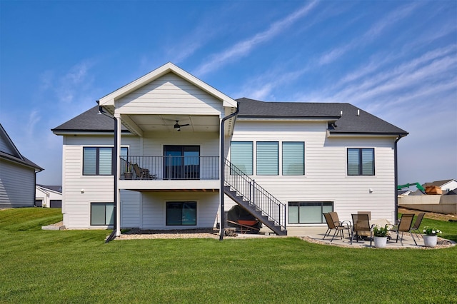 5021 148th Cir, Urbandale, IA 50323 - rear view of house featuring stairs, a patio, a yard, a ceiling fan, and a shingled roof