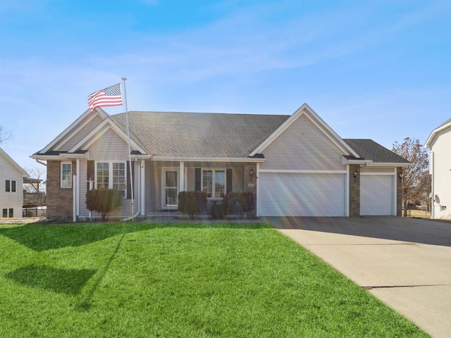 ranch-style home with driveway, an attached garage, a front lawn, and brick siding