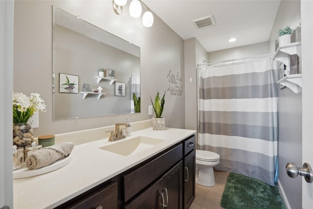 bathroom with a shower with curtain, visible vents, toilet, vanity, and tile patterned flooring