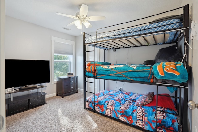 bedroom featuring a ceiling fan, carpet, visible vents, and baseboards