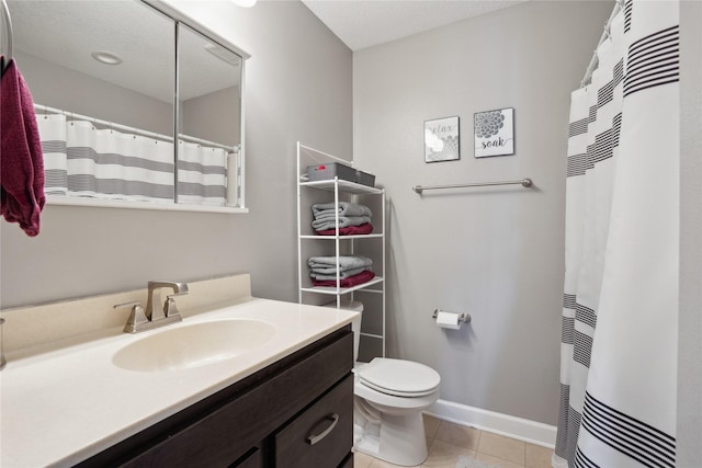 full bathroom featuring a shower with curtain, toilet, vanity, tile patterned flooring, and baseboards