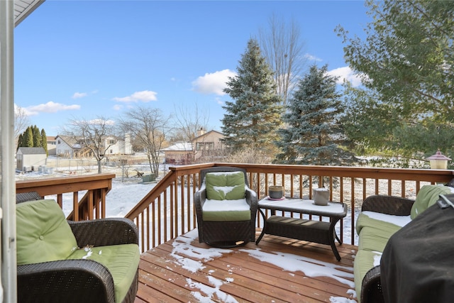 view of snow covered deck