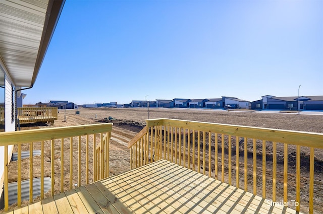 wooden terrace with a residential view