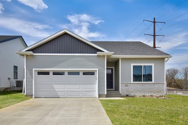 single story home with central air condition unit, a front lawn, driveway, and an attached garage
