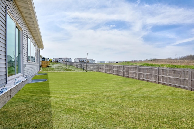 view of yard featuring a fenced backyard