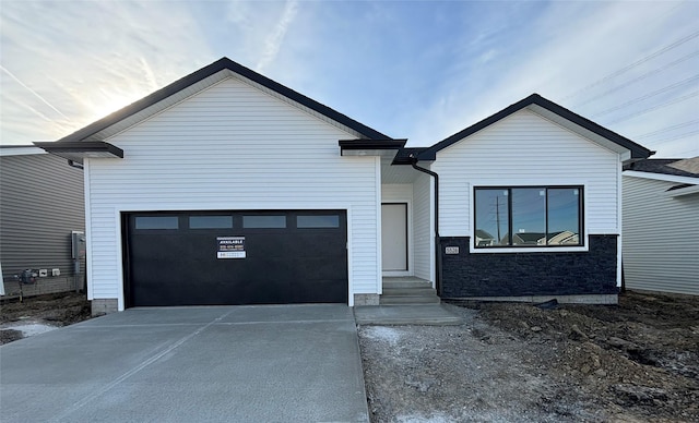 view of front of home featuring an attached garage and driveway