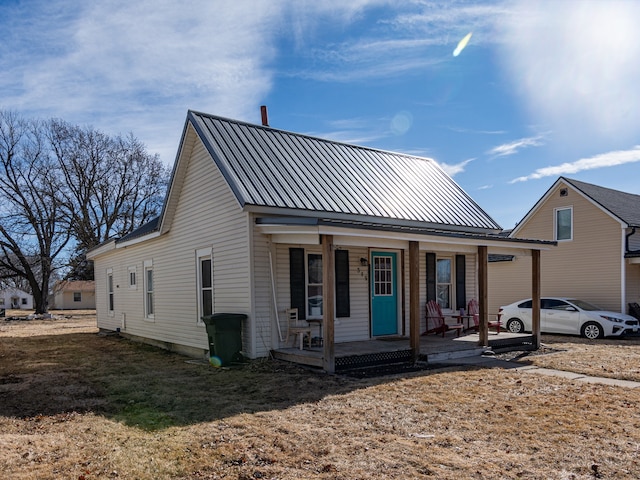 view of front of property with a porch and metal roof