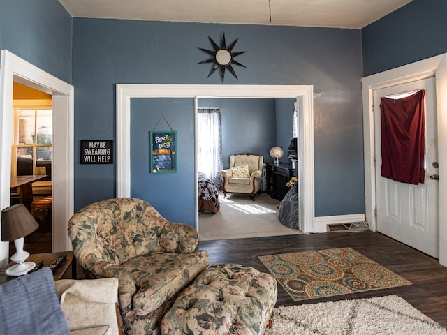 entrance foyer with a healthy amount of sunlight, baseboards, and wood finished floors