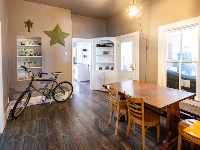 dining area featuring dark wood-style flooring