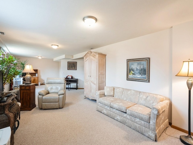 living room with light carpet, visible vents, and baseboards