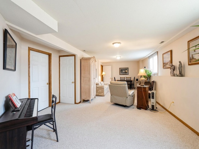 living area with carpet, visible vents, and baseboards