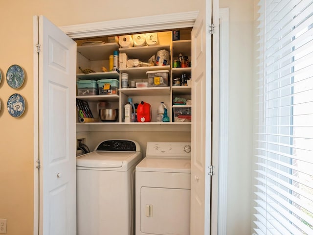 washroom featuring laundry area and washer and clothes dryer