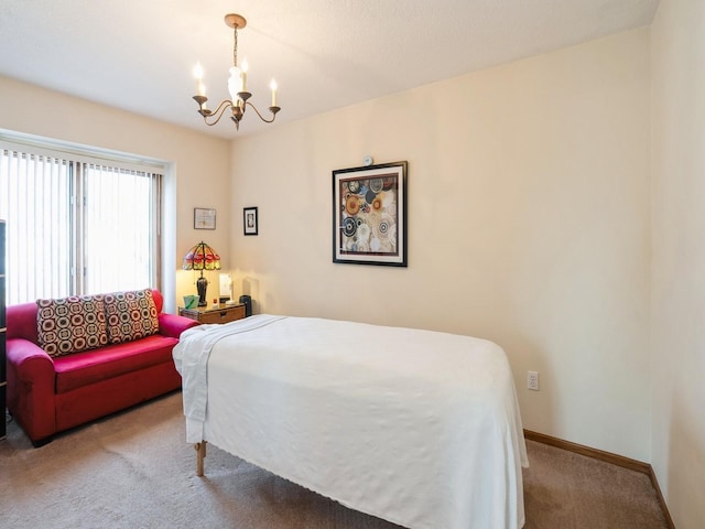 carpeted bedroom featuring an inviting chandelier and baseboards