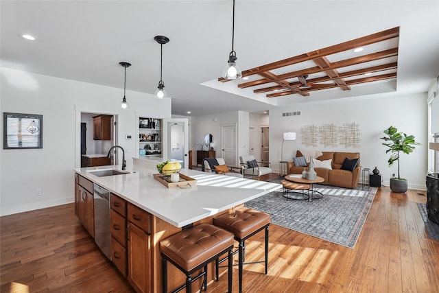 kitchen with coffered ceiling, a sink, visible vents, light wood-style floors, and dishwasher