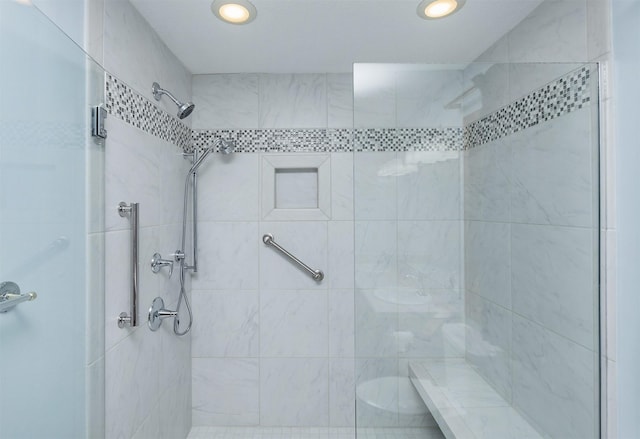 bathroom featuring recessed lighting and a stall shower