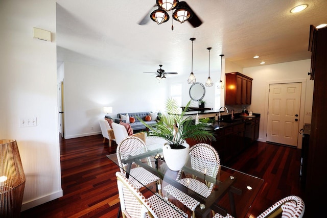 dining space featuring dark wood-style floors, recessed lighting, baseboards, and a ceiling fan