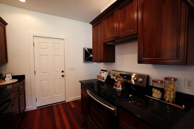 kitchen featuring dark countertops, stainless steel range with electric stovetop, baseboards, and dark wood-style flooring