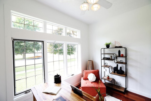 home office with ceiling fan, baseboards, and wood finished floors