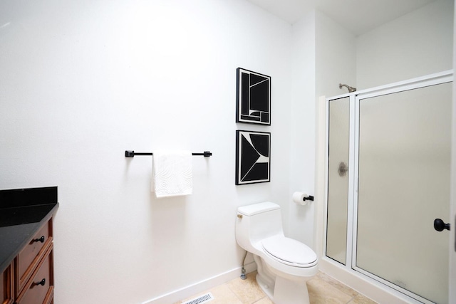 full bath with a stall shower, baseboards, toilet, and tile patterned floors