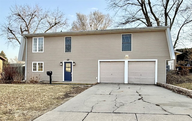 traditional-style house featuring driveway and a garage