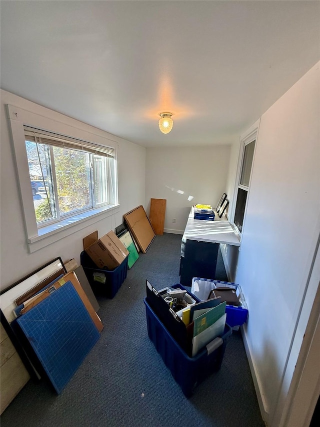 carpeted bedroom with baseboards