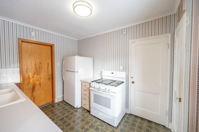 kitchen with ornamental molding, light countertops, white appliances, and wallpapered walls