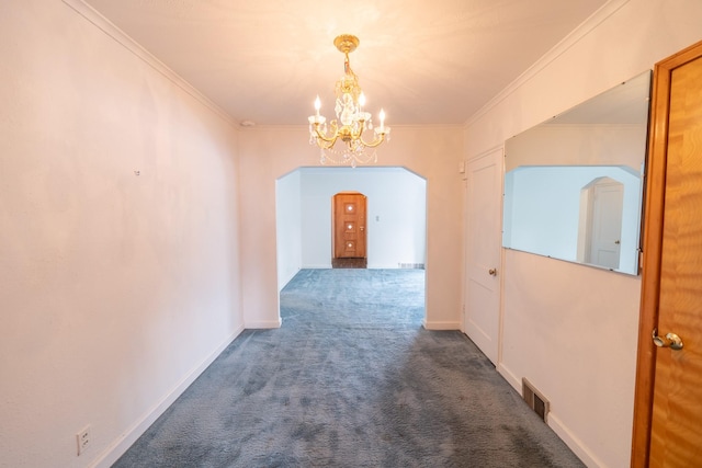 hallway with arched walkways, carpet, visible vents, and crown molding