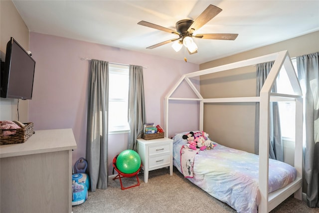 bedroom with carpet floors and a ceiling fan