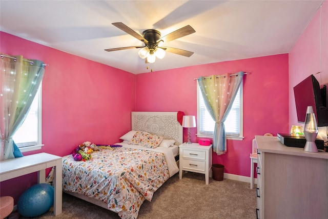 bedroom with ceiling fan, carpet flooring, and baseboards