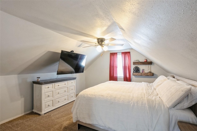 bedroom featuring a textured ceiling, vaulted ceiling, a ceiling fan, and light colored carpet