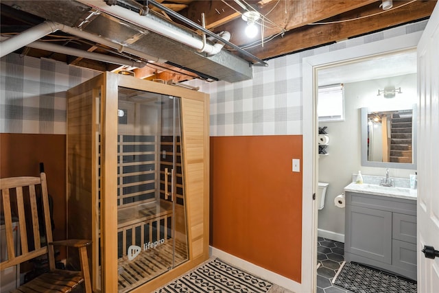 interior space featuring vanity and baseboards