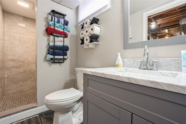 full bath featuring tile patterned flooring, a shower stall, toilet, and vanity