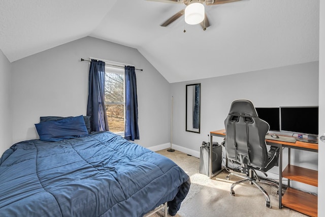 bedroom featuring carpet floors, vaulted ceiling, baseboards, and ceiling fan