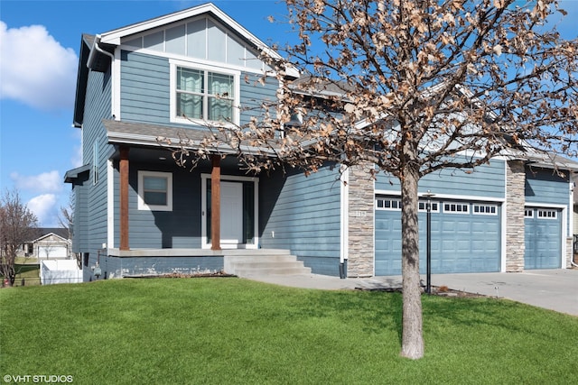 craftsman-style home with concrete driveway, an attached garage, board and batten siding, stone siding, and a front lawn