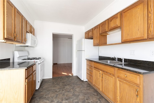 kitchen featuring crown molding, brown cabinetry, stone finish flooring, a sink, and white appliances