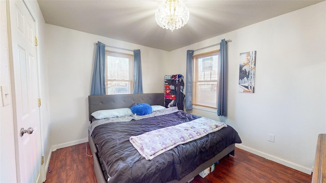 2809 Easton Blvd, Des Moines, IA 50317 - bedroom with wood finished floors and a chandelier